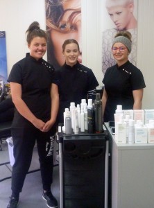 Three girls in salon uniforms